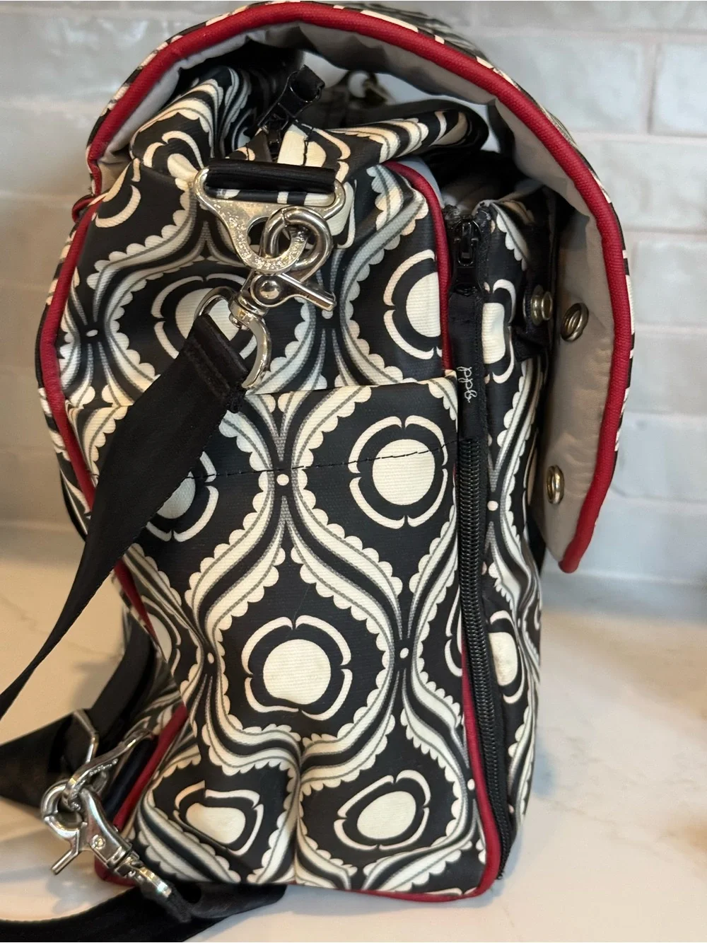 Petunia Pickle Bottom Black & White Geometric Baby Bag with Red Accent